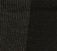 Load image into Gallery viewer, Closeup of our black cozy socks, with extra nylon on the sole for longer wear.