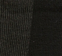 Load image into Gallery viewer, Closeup of our black cozy socks, with extra nylon on the sole for longer wear.
